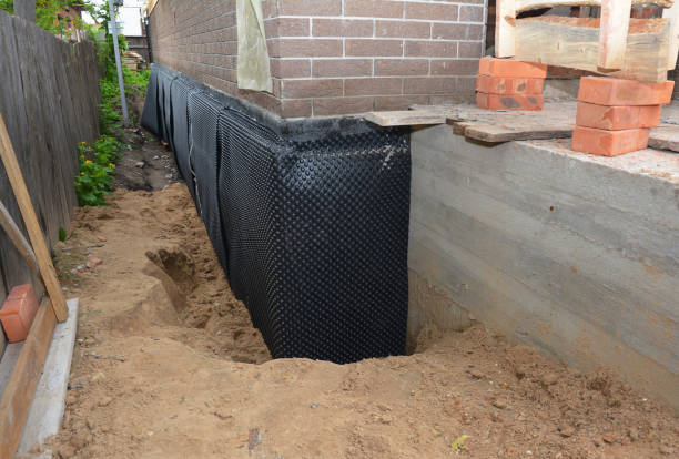 SJ Waterproofing Pros technician performing targeted Interior Drainage System assessment in Trafford, AL